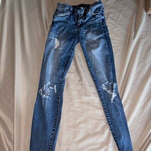 Selling dark washed ripped skinny jeans!